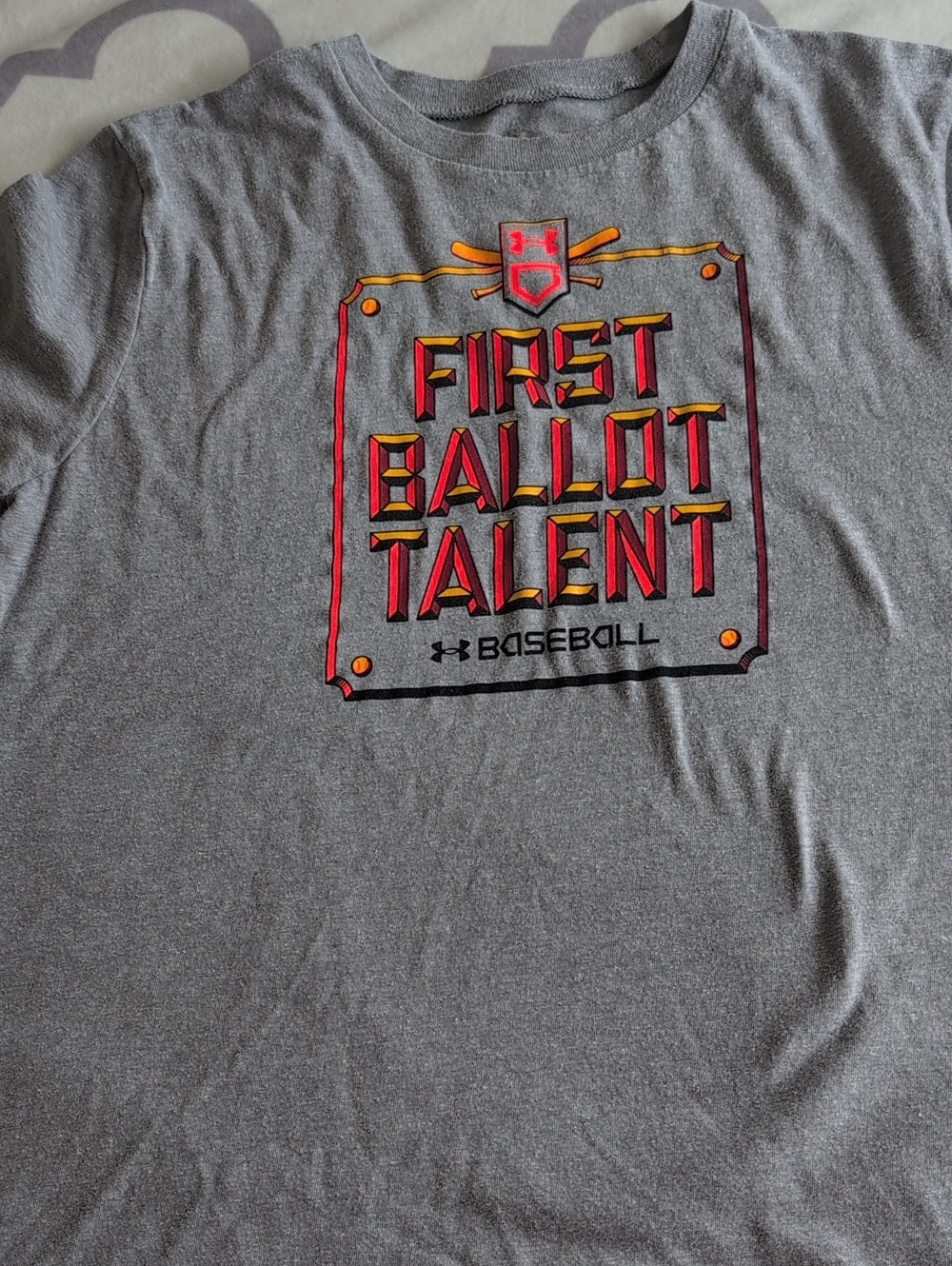 Baseball Under Armour Gray Tee with Red and Yellow 'First Ballot Talent' Graphic